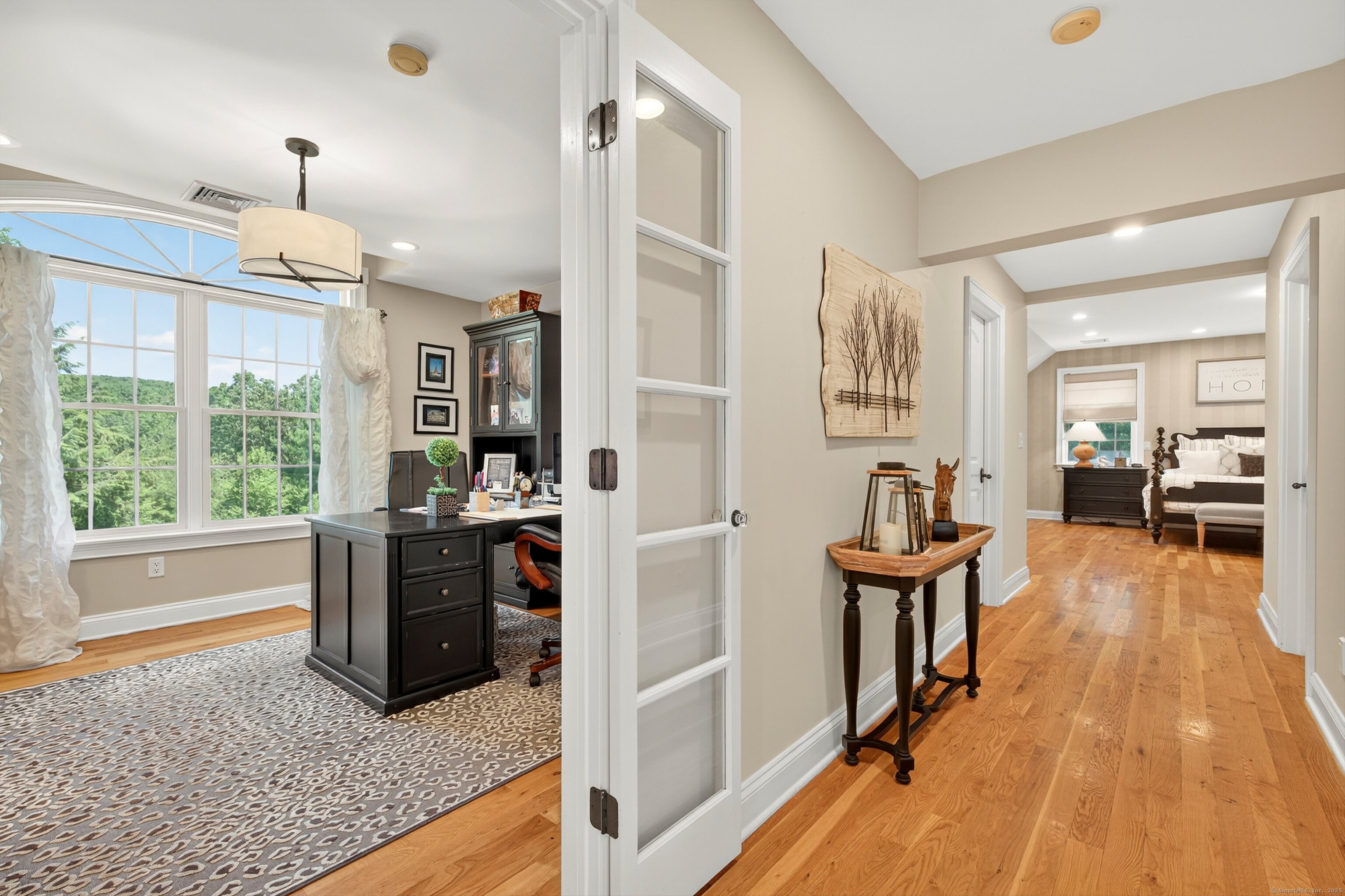 99 Carriage Lane Roxbury, CT 06783 - Photo 21 of 38 a view of a livingroom with furniture hardwood floor and a ceiling fan