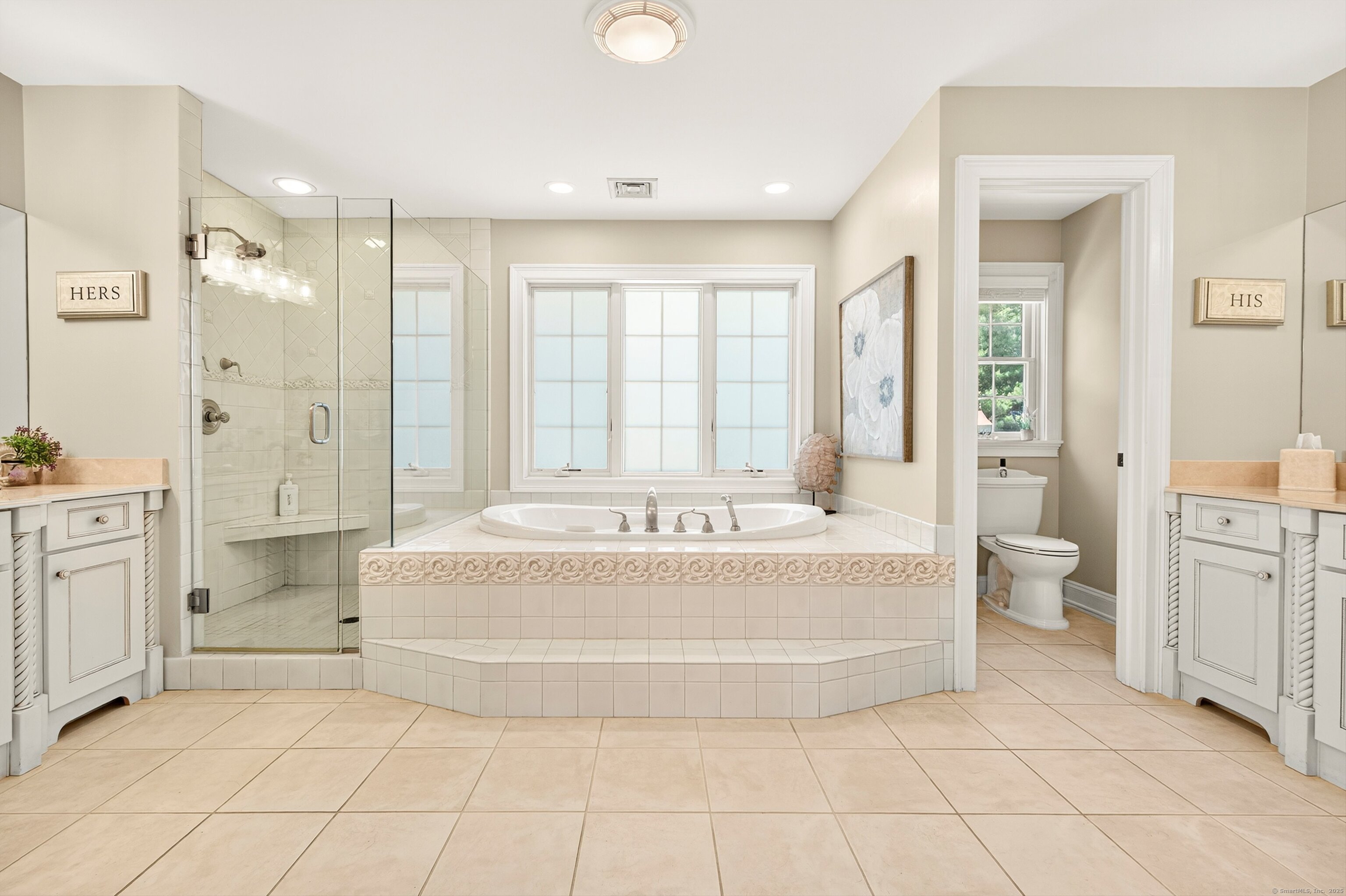 99 Carriage Lane Roxbury, CT 06783 - Photo 24 of 38 a spacious bathroom with a tub shower and mirror