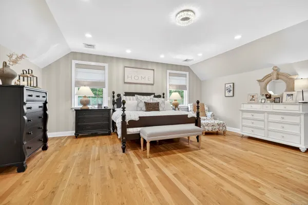 a bedroom with furniture and a dresser
