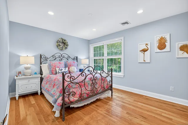 a bed room with a bed and a window