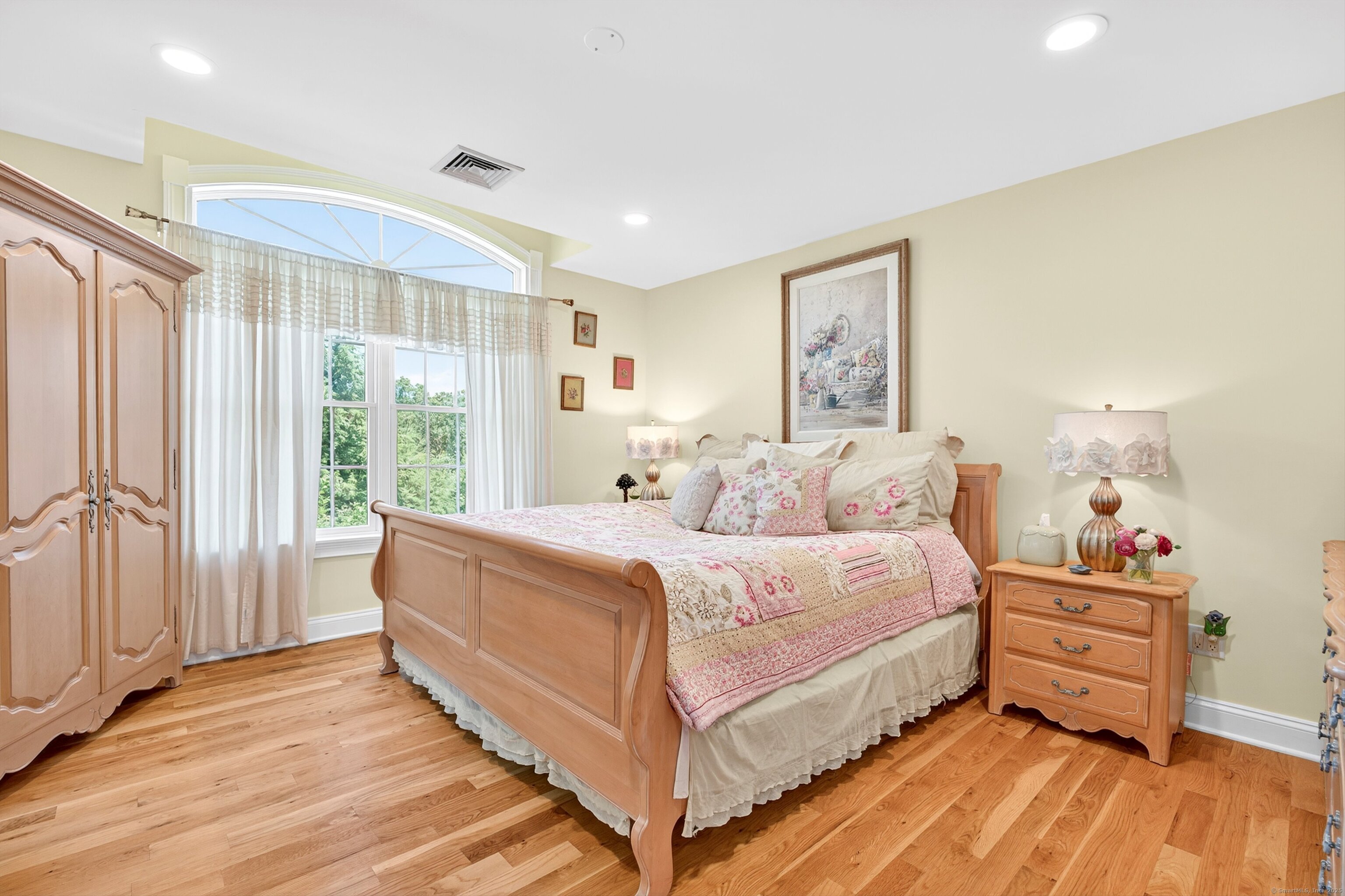99 Carriage Lane Roxbury, CT 06783 - Photo 29 of 38 a large bedroom with a bed and large windows
