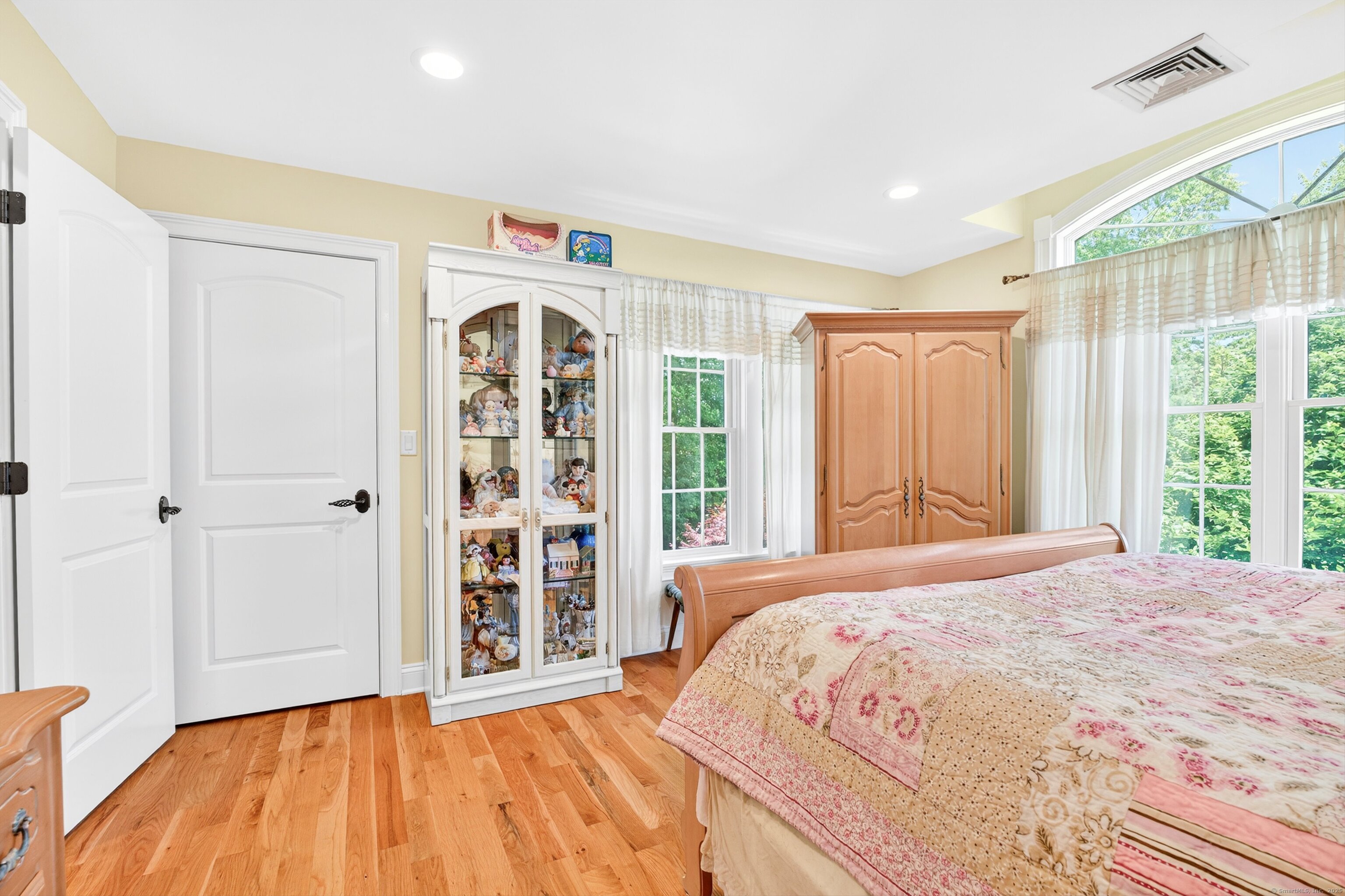 99 Carriage Lane Roxbury, CT 06783 - Photo 30 of 38 a bedroom with a large bed and a window