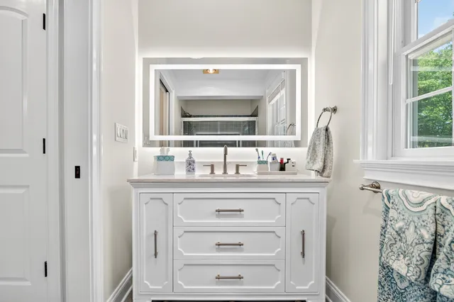 a bathroom with a sink and a mirror