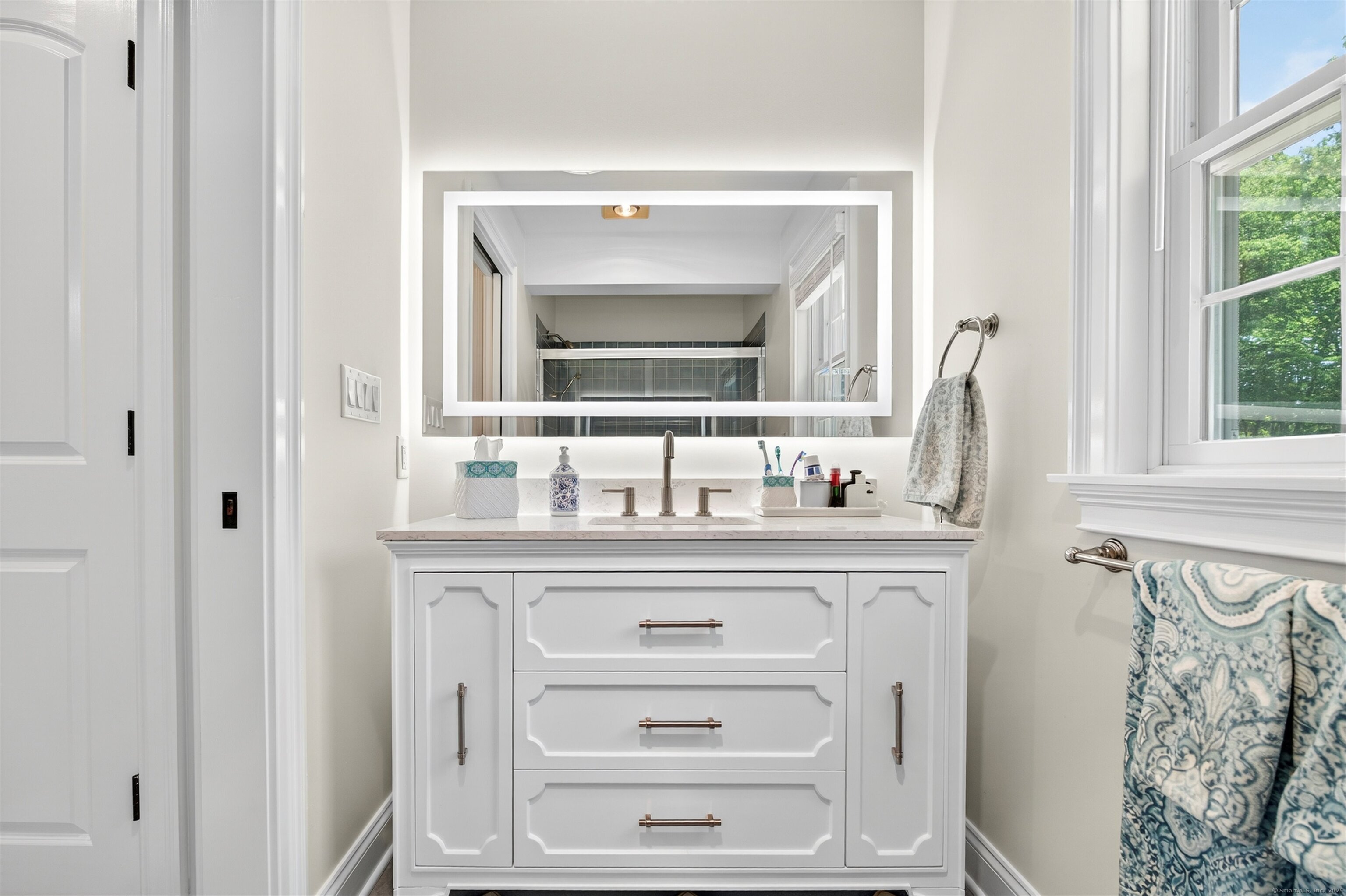 99 Carriage Lane Roxbury, CT 06783 - Photo 32 of 38 a bathroom with a sink and a mirror