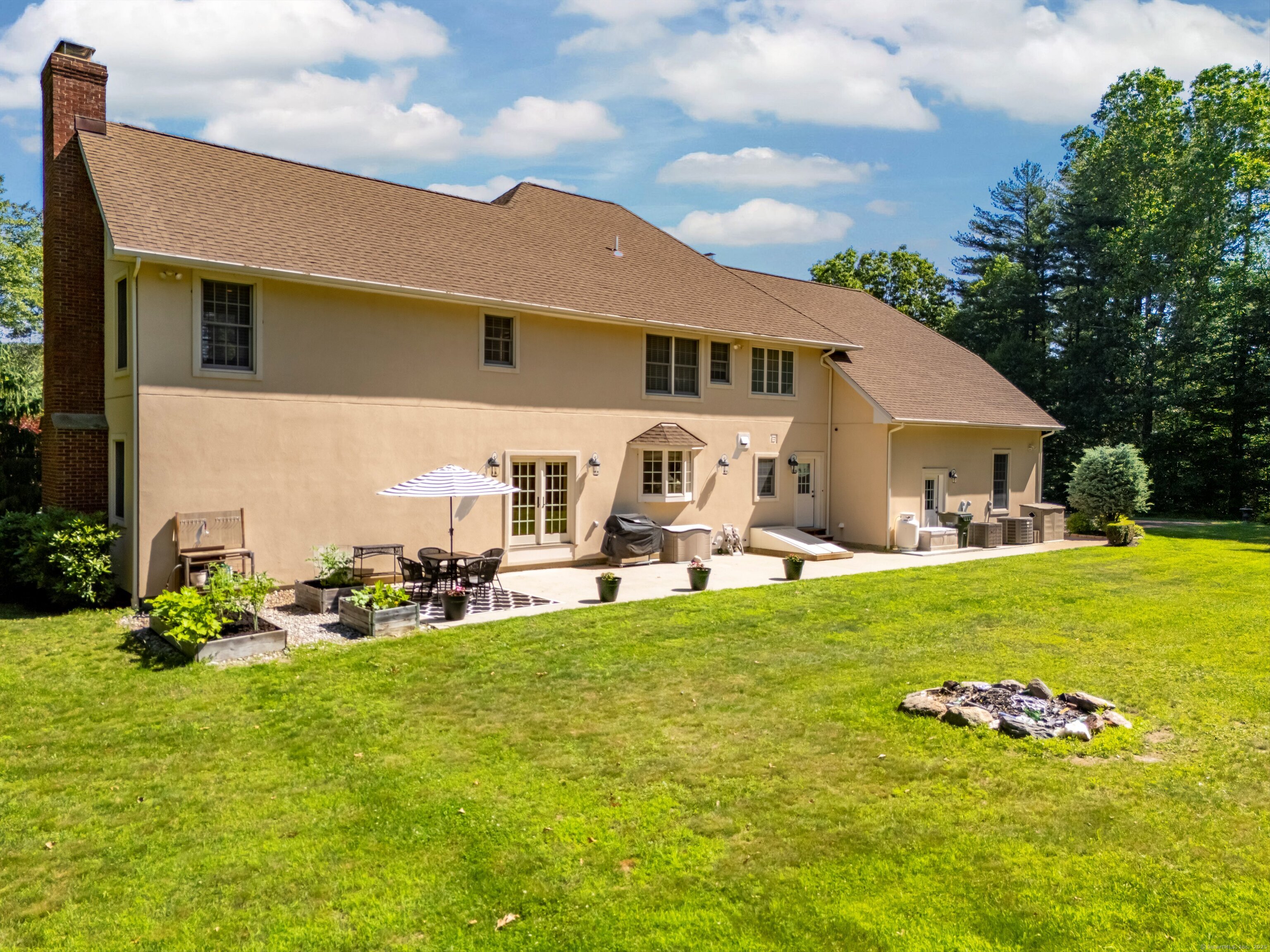 99 Carriage Lane Roxbury, CT 06783 - Photo 36 of 38 a front view of house with yard and seating area