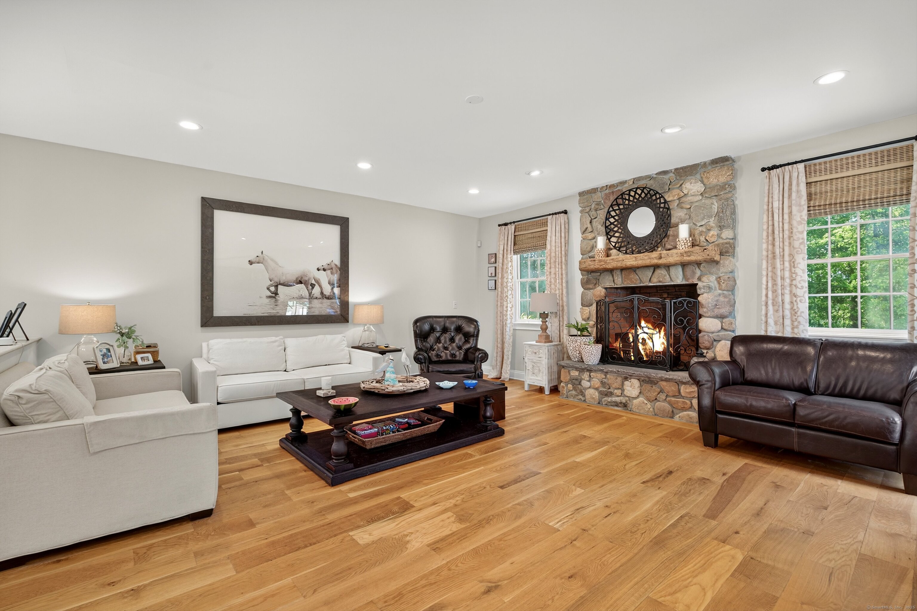 99 Carriage Lane Roxbury, CT 06783 - Photo 5 of 38 a living room with furniture and a fireplace