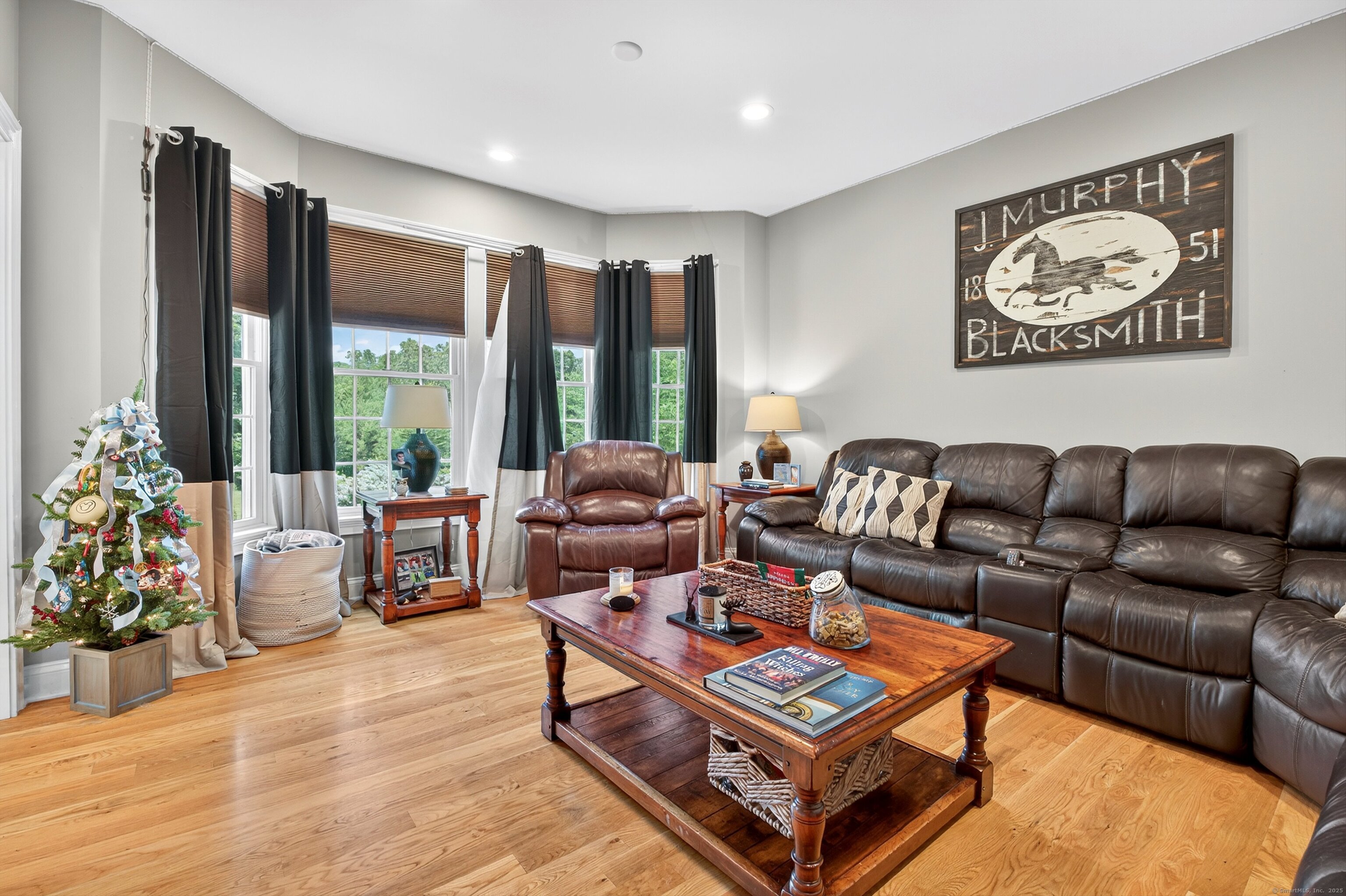 99 Carriage Lane Roxbury, CT 06783 - Photo 6 of 38 a living room with furniture a rug and a large window