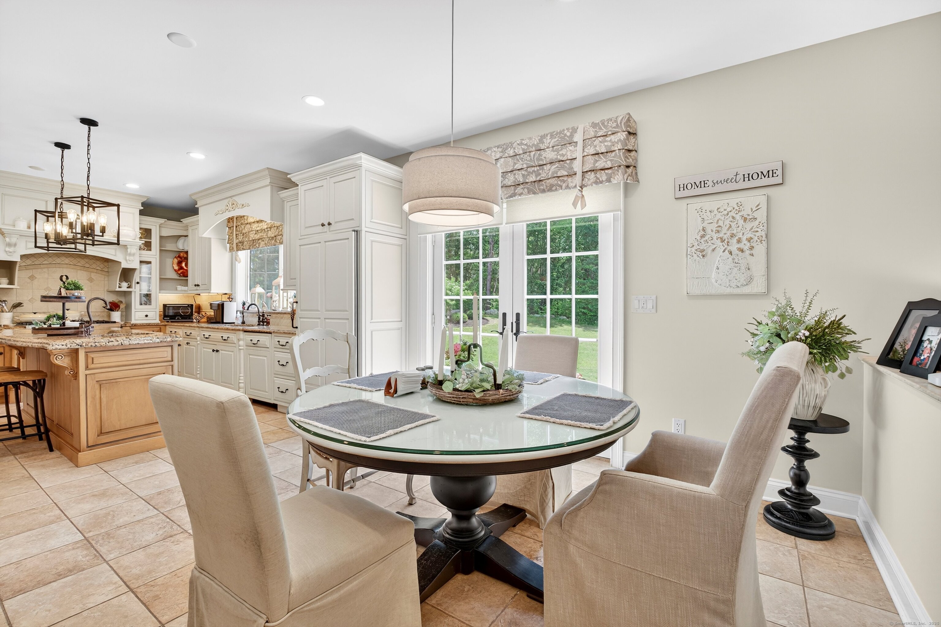 99 Carriage Lane Roxbury, CT 06783 - Photo 8 of 38 a view of a dining room with furniture window and outside view