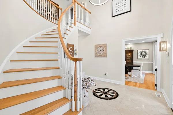 a view of entryway with kitchen and hall