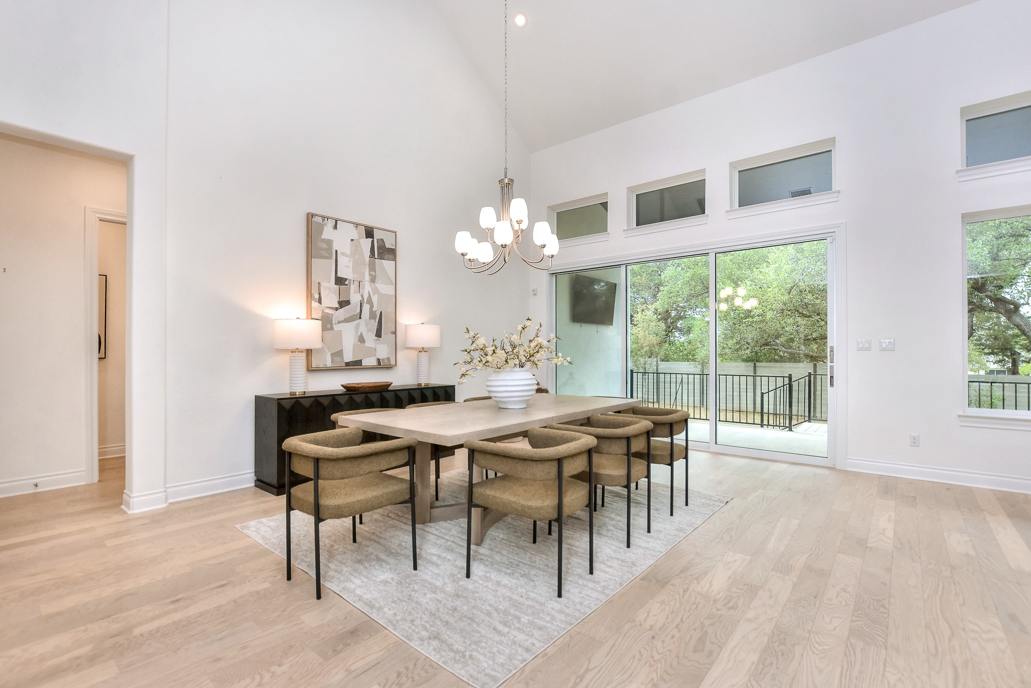 309 Wolf Rdg Road Georgetown, TX 78628 - Photo 14 of 39 Dining area featuring light wood finished floors, hanging lights, and vaulted ceiling