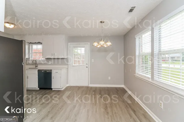 a view of a kitchen with a sink and dishwasher kitchen view