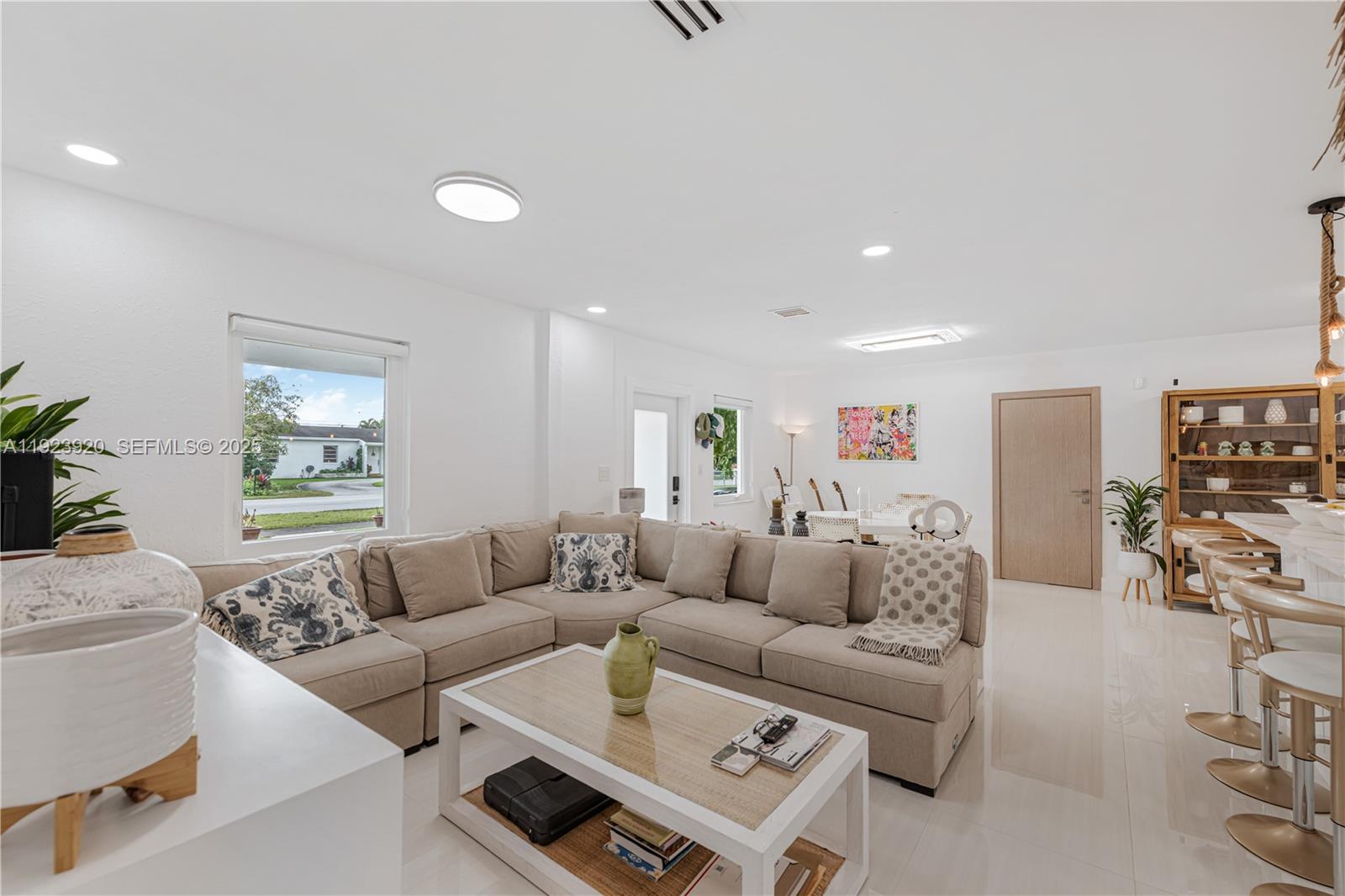 7235 Southwest 39th Street Miami, FL 33155 - Photo 13 of 30 a living room with furniture and a couch