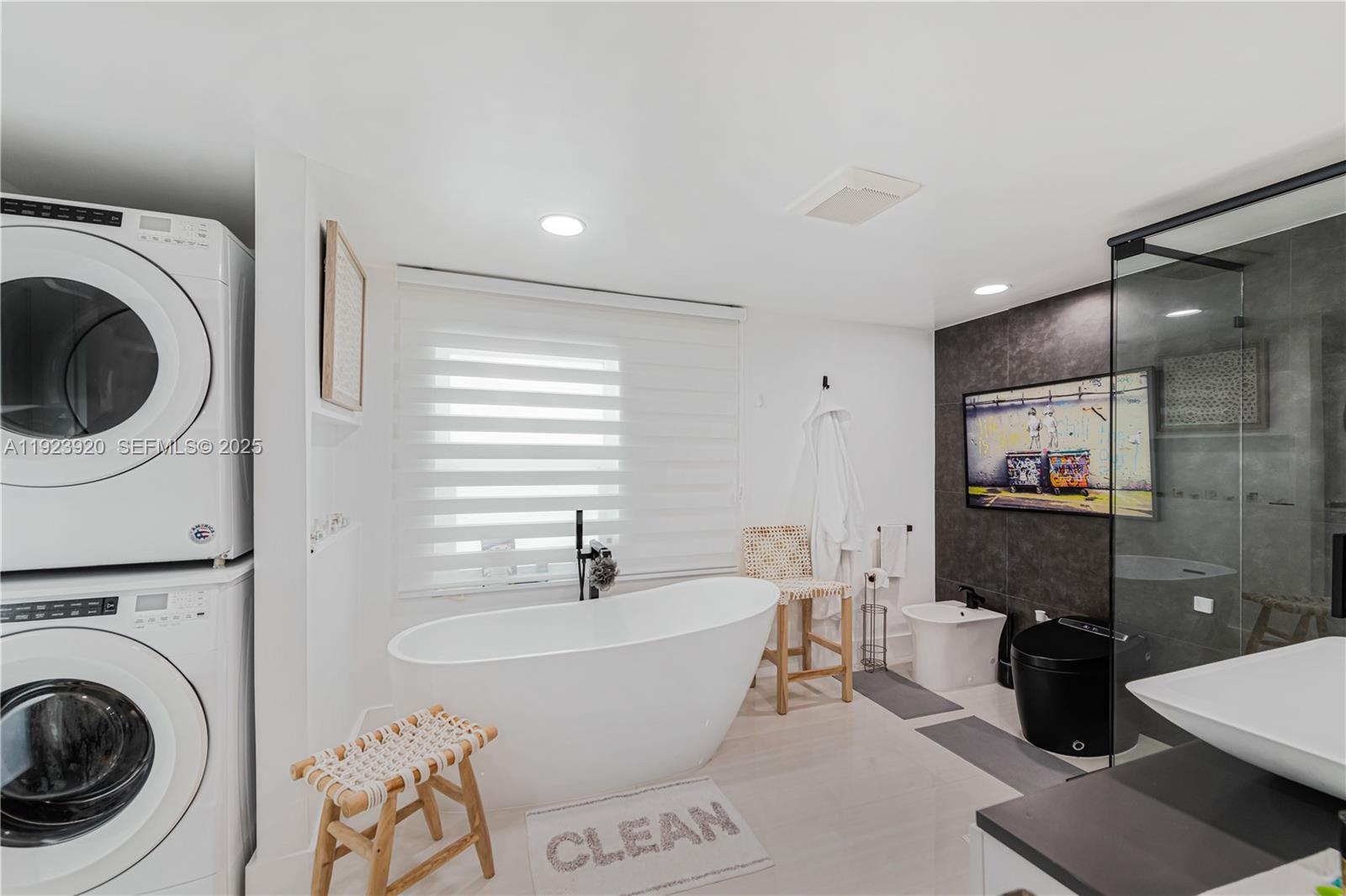 7235 Southwest 39th Street Miami, FL 33155 - Photo 18 of 30 a living room with furniture and a flat screen tv