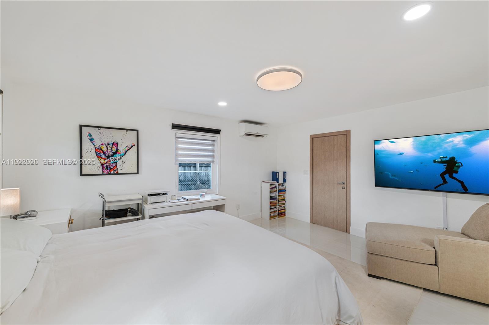 7235 Southwest 39th Street Miami, FL 33155 - Photo 20 of 30 a bedroom with a bed and a couch