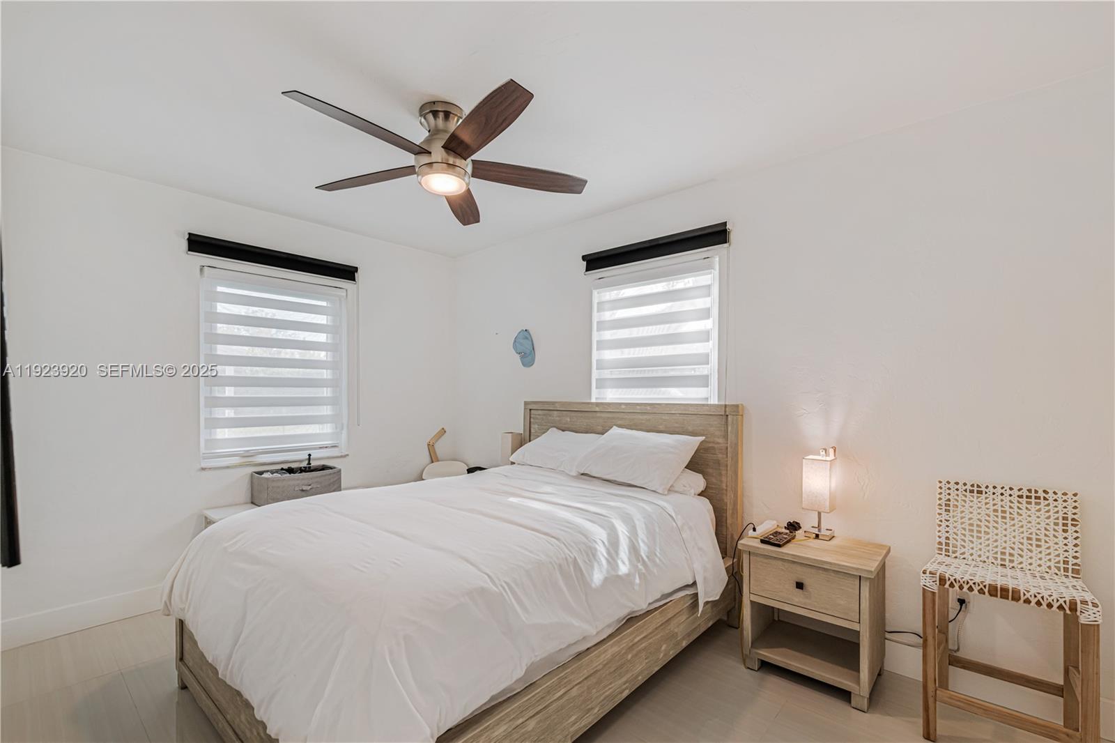 7235 Southwest 39th Street Miami, FL 33155 - Photo 21 of 30 a bedroom with a bed and a window
