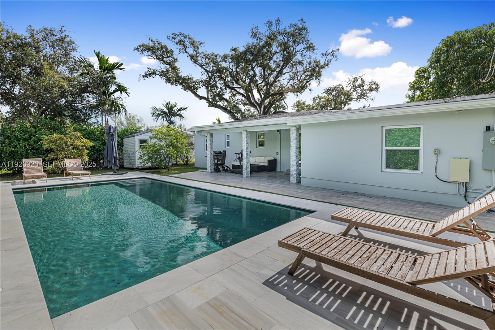 7235 Southwest 39th Street Miami, FL 33155 - Photo 25 of 30 a view of a backyard with a patio