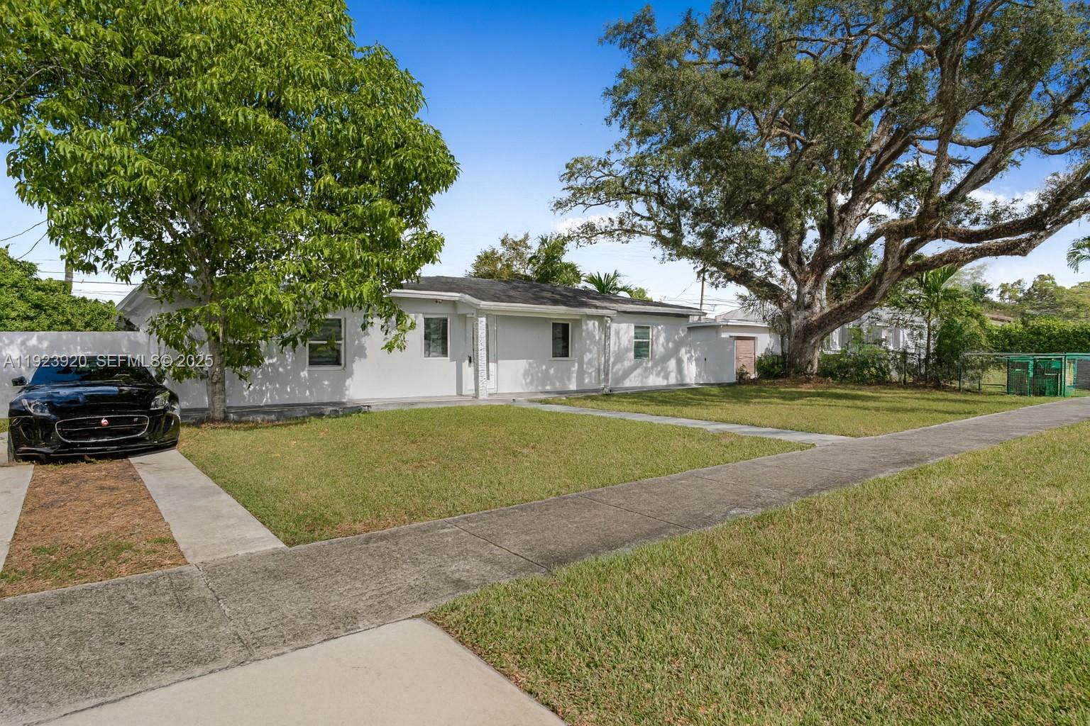 7235 Southwest 39th Street Miami, FL 33155 - Photo 29 of 30 a view of house with a swimming pool