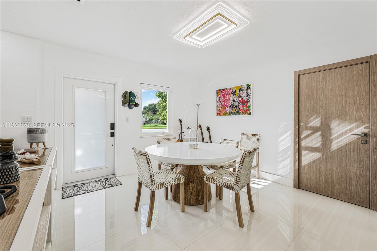 7235 Southwest 39th Street Miami, FL 33155 - Photo 8 of 30 a view of a dining room with furniture and wooden floor