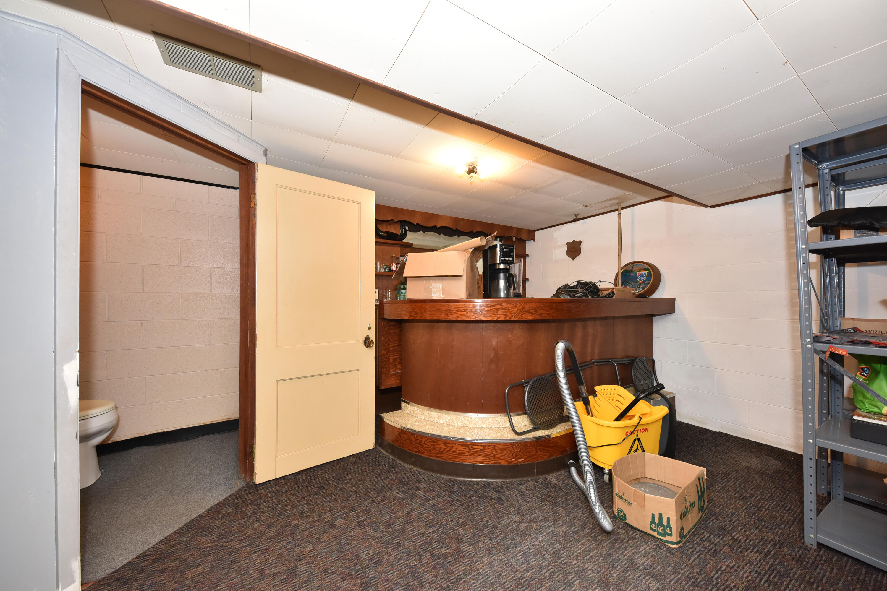 3370 South Howell Avenue, Unit 3372 Milwaukee, WI 53207 - Photo 32 of 38 Lower Level Half Bath & Bar