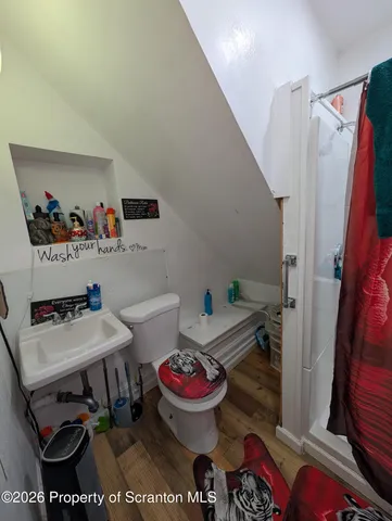 a room with furniture and a wooden floor