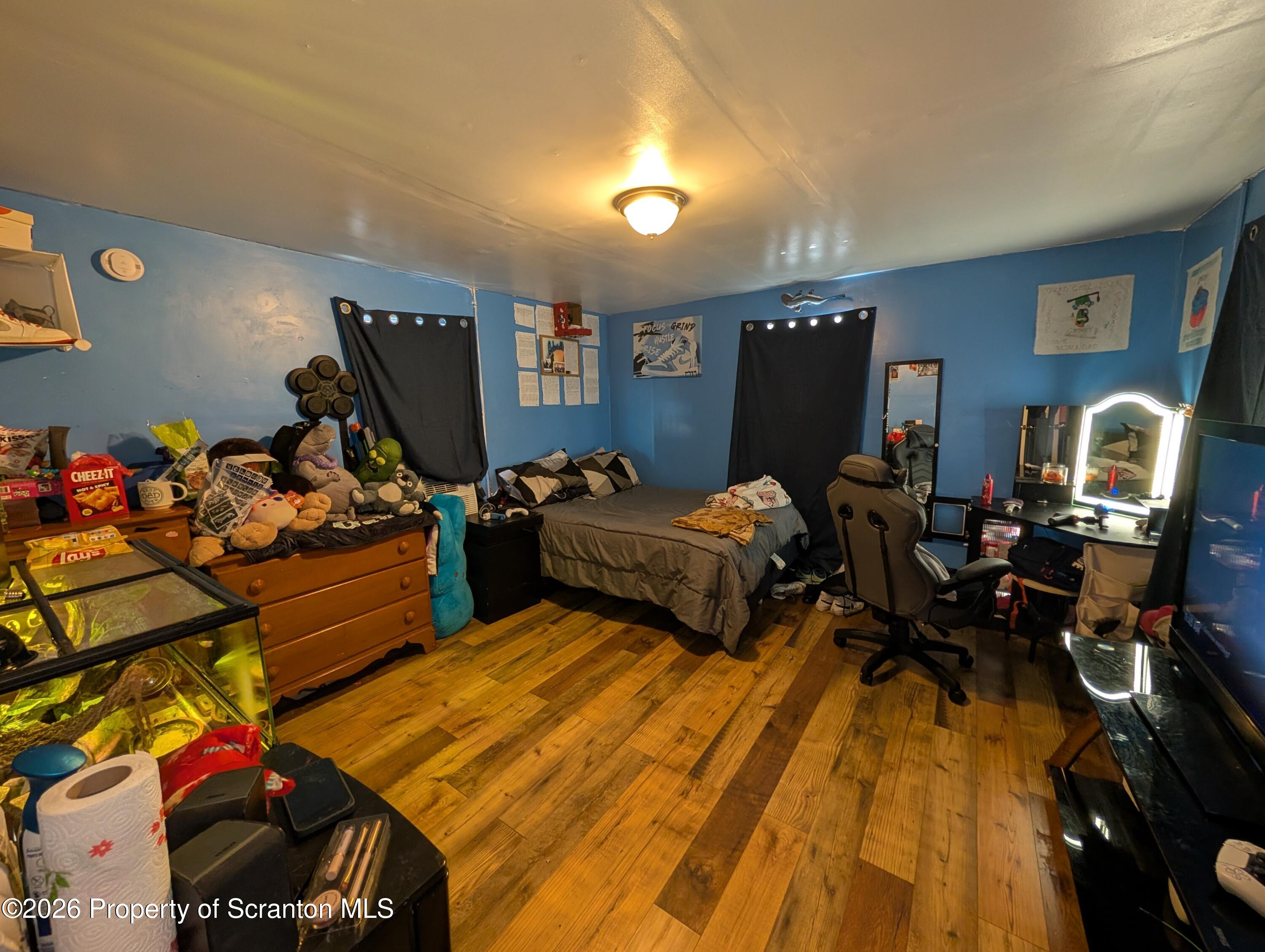 2402 North Main Avenue Scranton, PA 18508 - Photo 6 of 16 a bedroom with two beds and a wooden floor