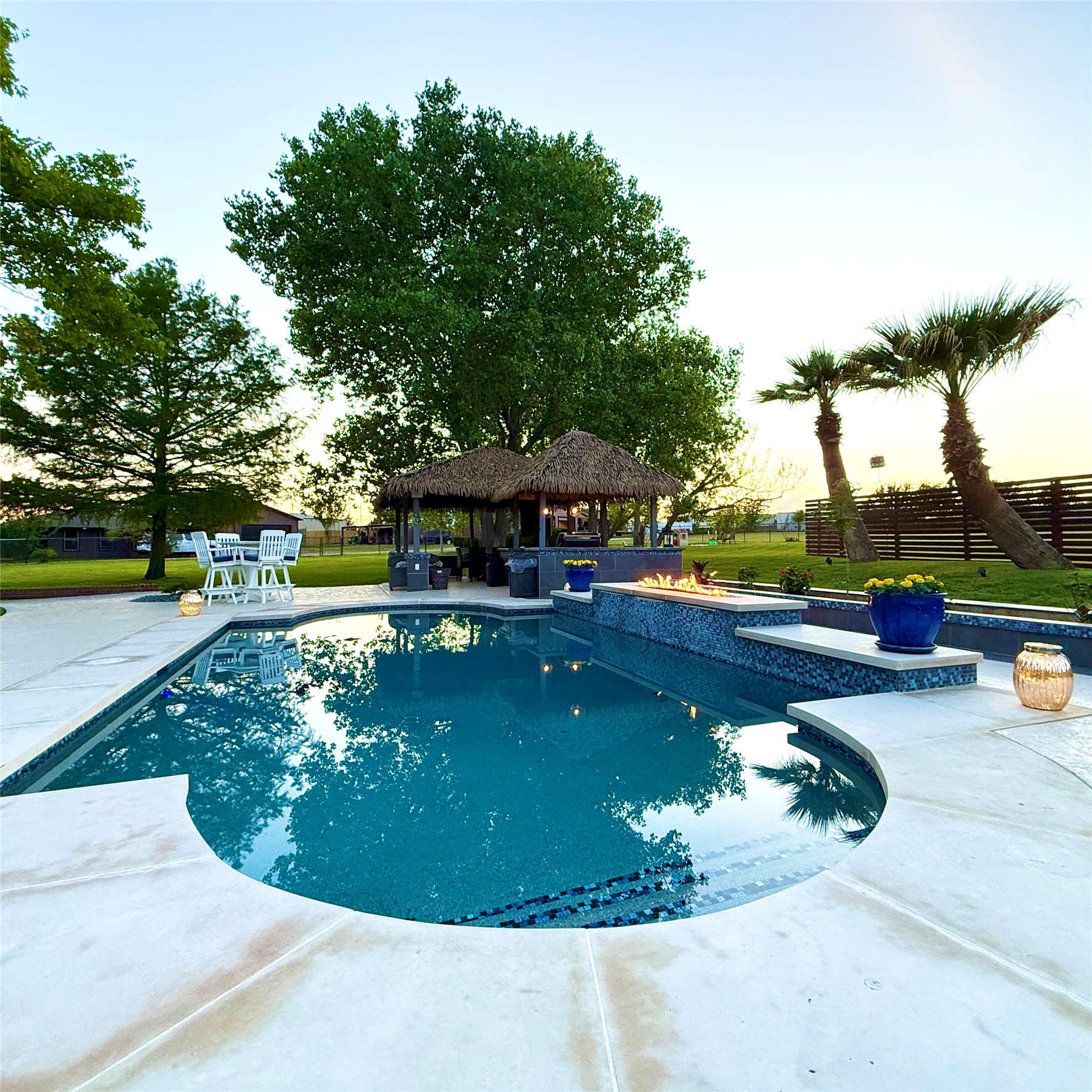 1902 Rowe Loop Pflugerville, TX 78660 - Photo 36 of 38 a view of a swimming pool with a patio and a yard