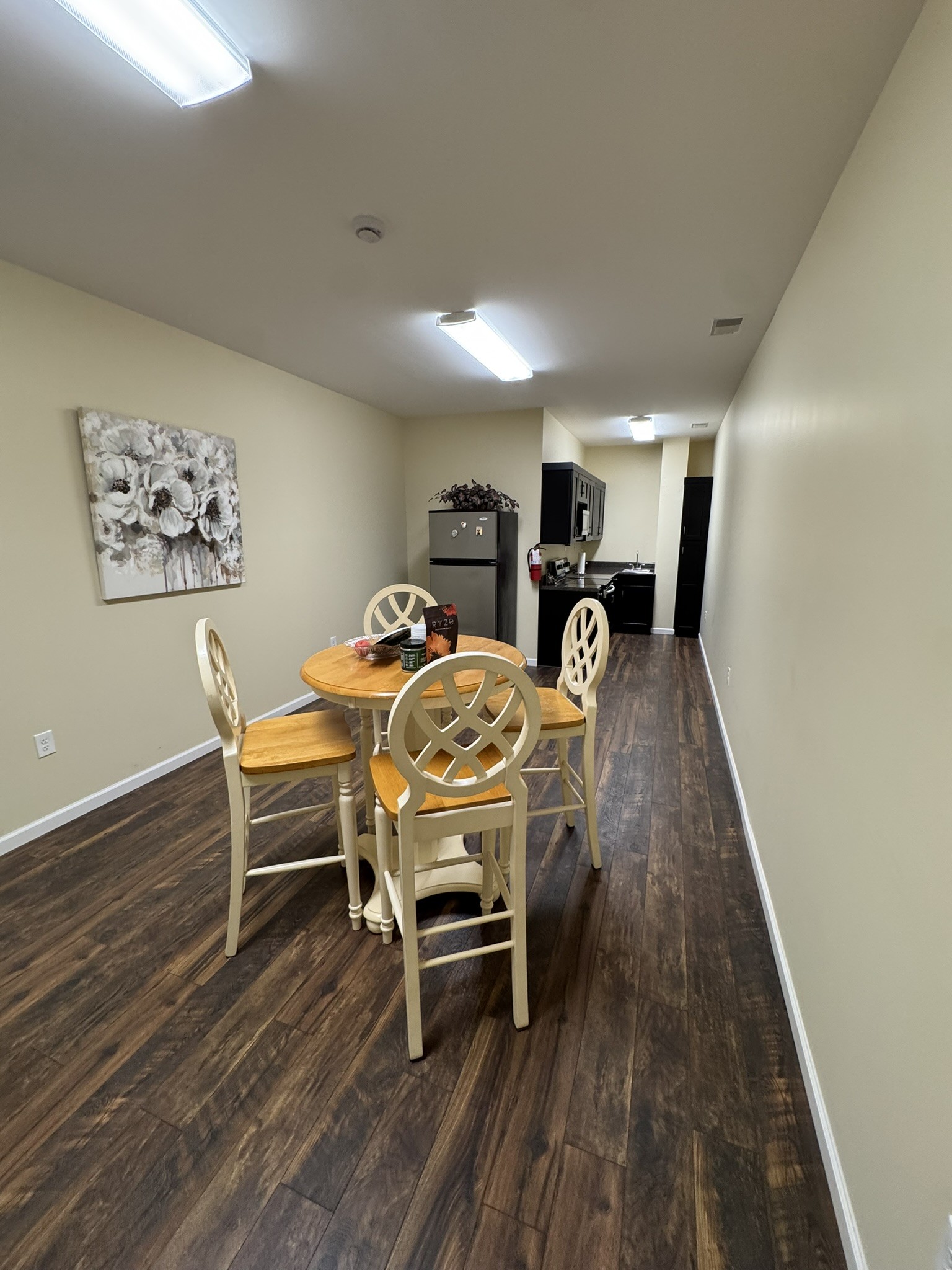 1087 Aedc Road Winchester, TN 37398 - Photo 22 of 28 a view of a dining room and livingroom with furniture wooden floor a rug and a chandelier