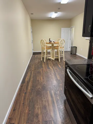 a living room with furniture and a gym