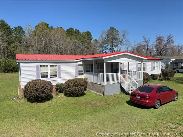 a house view with a backyard space