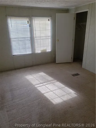 a view of a balcony with wooden floor