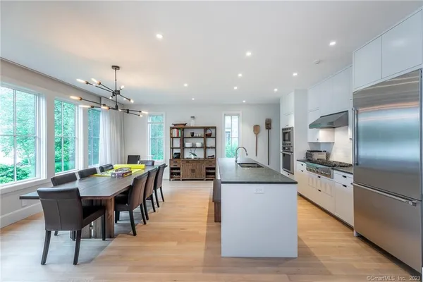 a dining room with furniture and a kitchen counter top