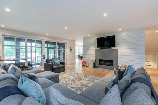 a living room with furniture fireplace and a flat screen tv