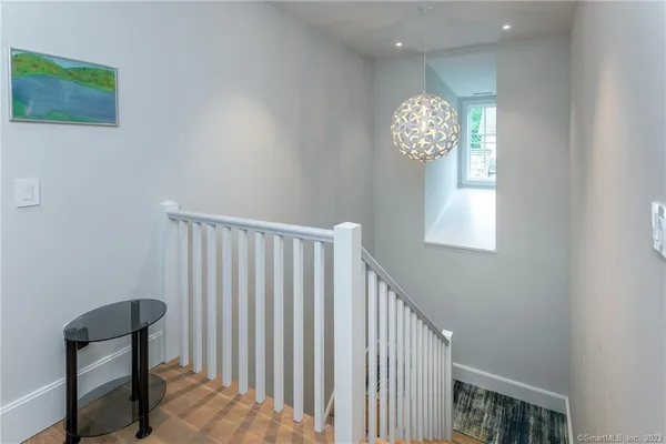a view of entryway with stairs and wooden floor