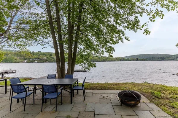 a view of a swimming pool and lounge chair