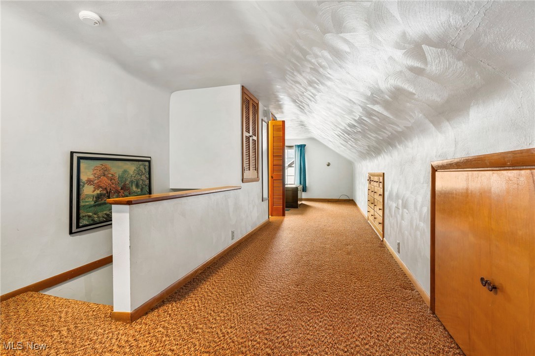 3002 Joseph Street Northwest Canton, OH 44708 - Photo 14 of 18 Hall featuring vaulted ceiling and carpet flooring