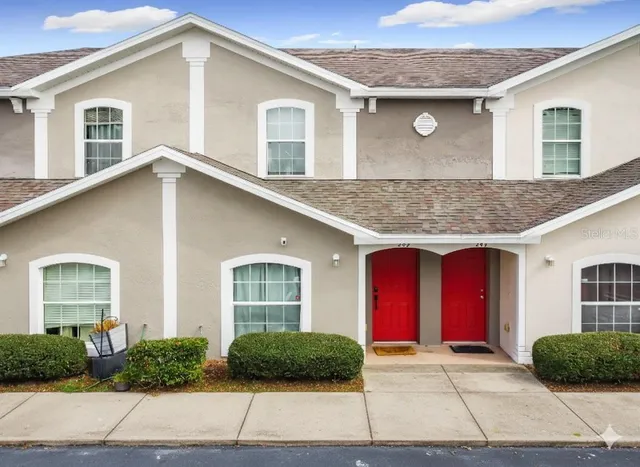 a front view of a house with garage