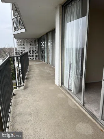 a living room with furniture and white walls