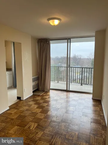 a view of a room with a large window