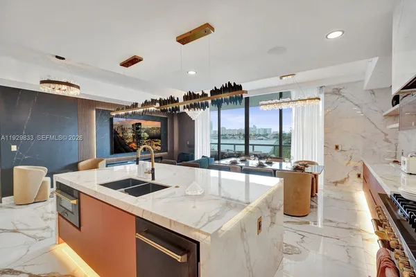a very nice looking dining room with a large window and dining table