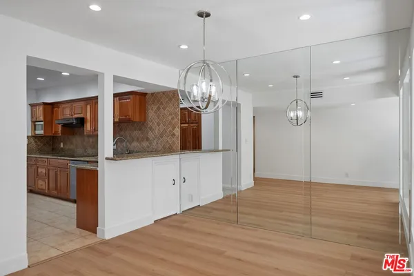 a view interior of a room and kitchen view