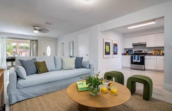 a living room with furniture and a fireplace