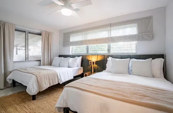 a bed room with a bed and a window
