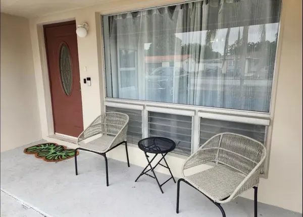 a view of a door and chair in a room