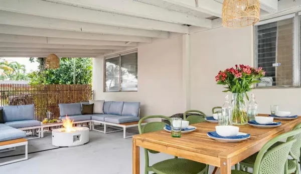 a view of a dining room with furniture window and outside view