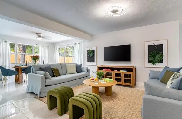 a living room with furniture and a flat screen tv
