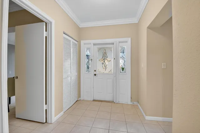 a spacious bedroom with a bed and window