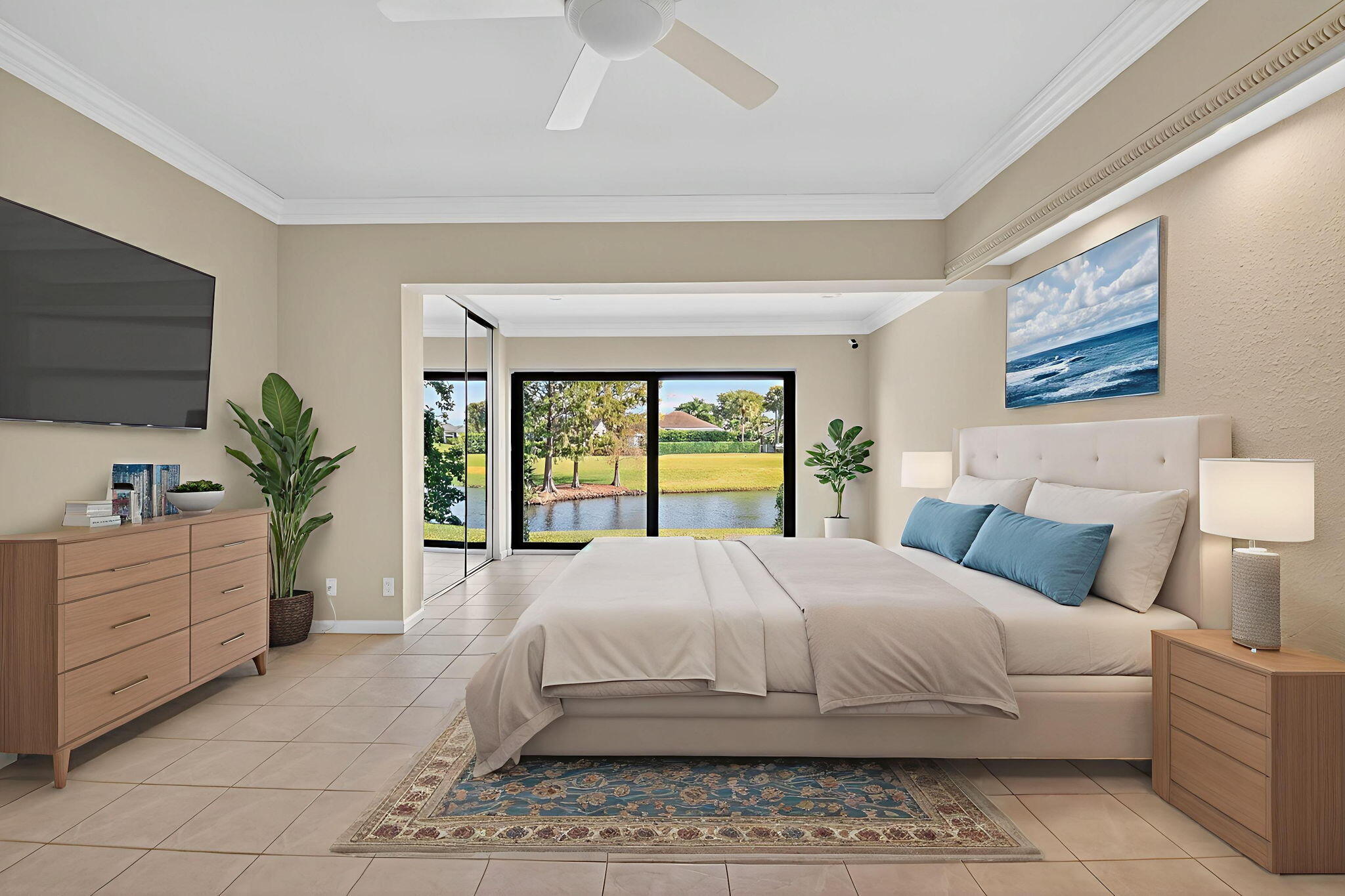 900 Greensward Lane, Unit 101G Delray Beach, FL 33445 - Photo 18 of 62 a bedroom with a large bed and a flat screen tv