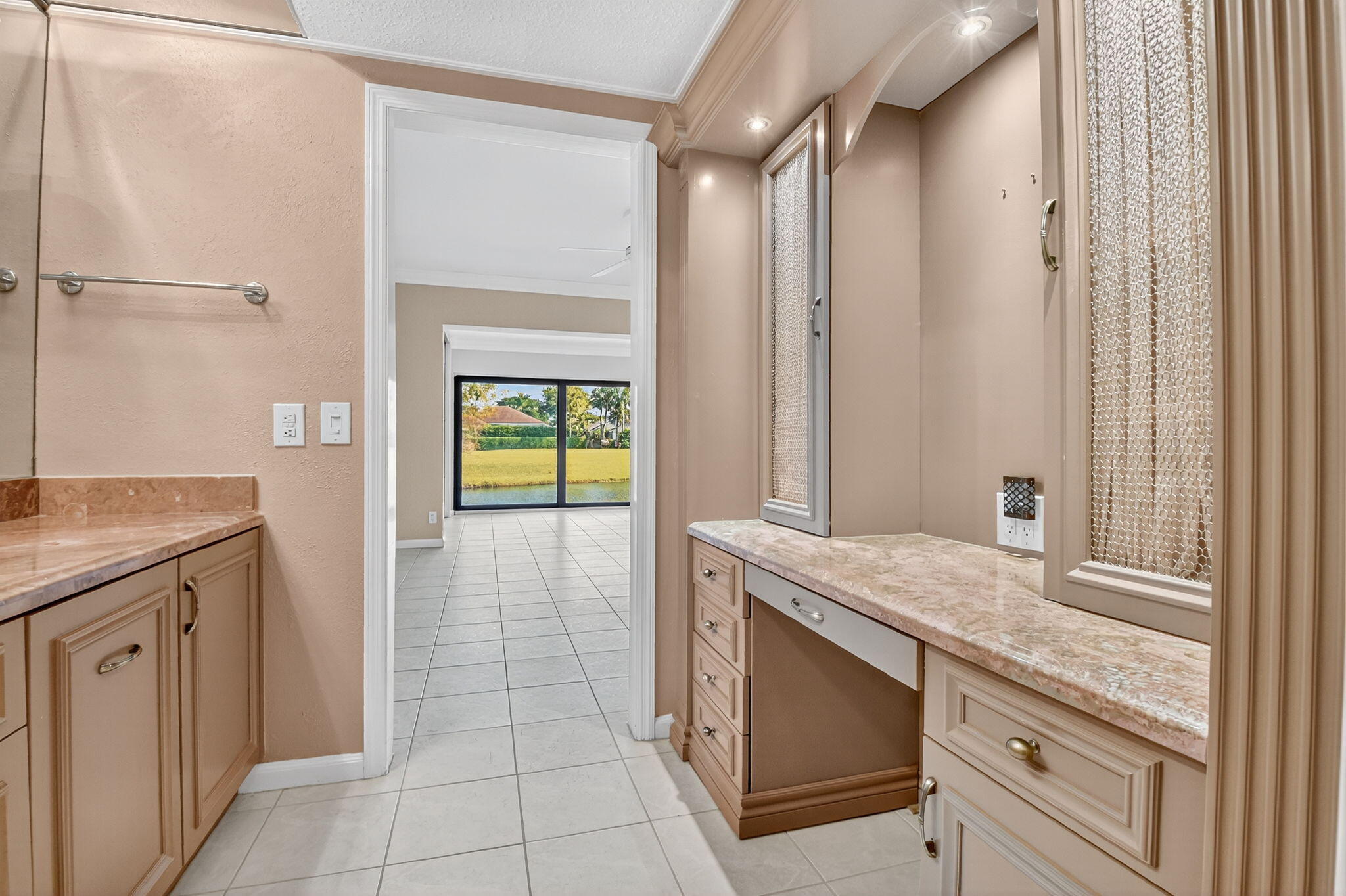 900 Greensward Lane, Unit 101G Delray Beach, FL 33445 - Photo 26 of 62 a kitchen with a sink and a refrigerator