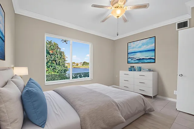 a living room with furniture and a lamp
