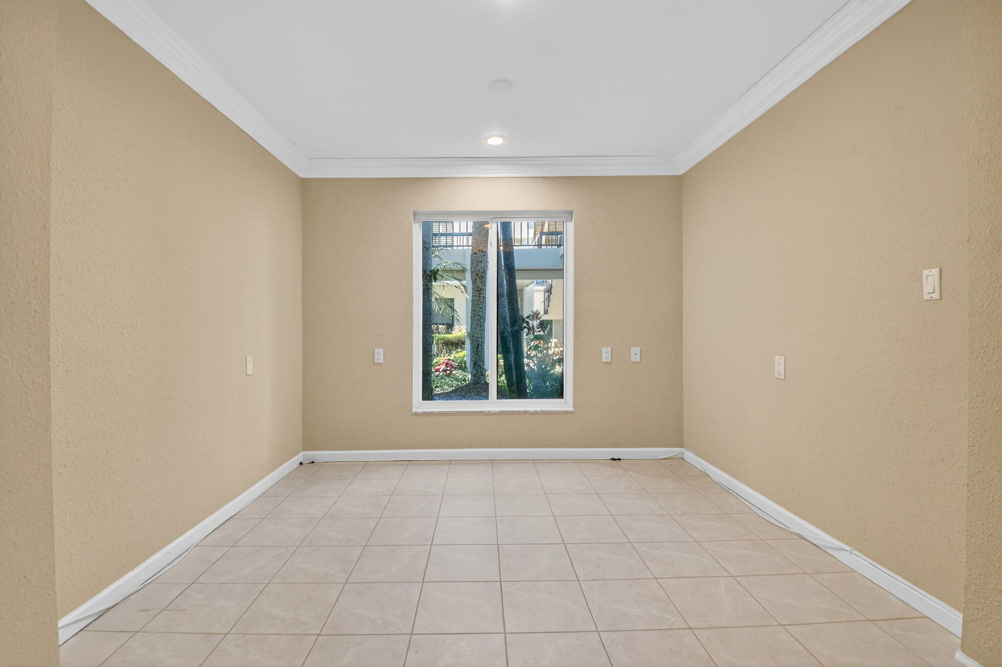 900 Greensward Lane, Unit 101G Delray Beach, FL 33445 - Photo 40 of 62 a view of an empty room with a window